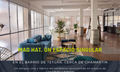 Foto publicitaria de Mad Hat. Espacio abierto con sofá, mesa de trabajo y decoraciones estilo vintage